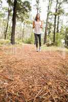 Young happy jogger walking