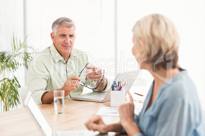 Casual business team discussing together Casual business team discussing together