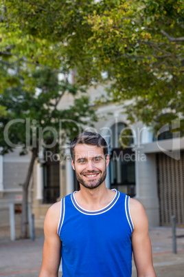 Handsome athlete smiling