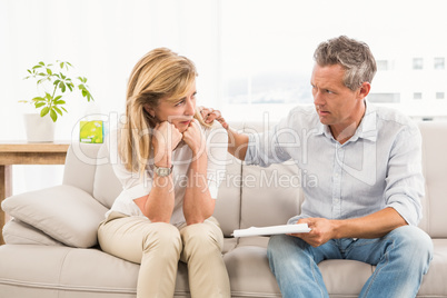 Concerned therapist comforting female patient