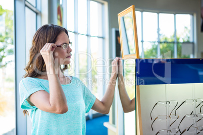 Woman shopping for new glasses