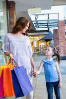 Mother and daughter shopping at the mall