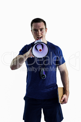 Male trainer yelling through the megaphone