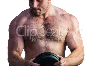 Strong bodybuilder holding a weight