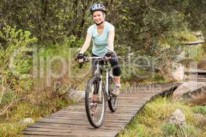 Smiling fit woman cycling her bike
