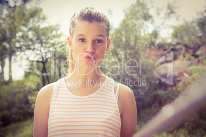 Pretty blonde sending kiss and taking selfies with selfiestick