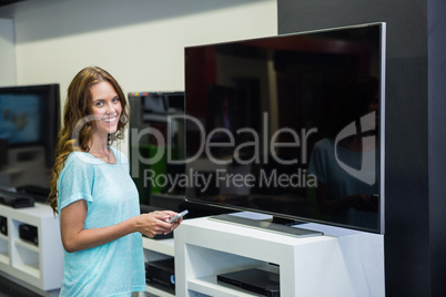Pretty woman shopping for new television