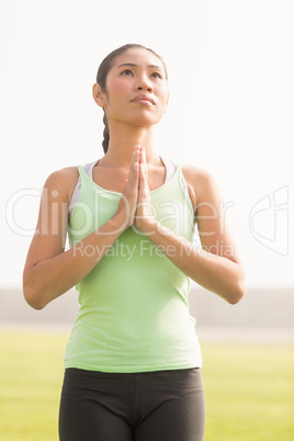 Focused sporty woman doing yoga