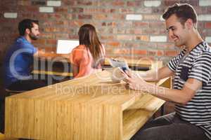 Young man reading a newspaper