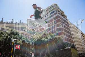 Athletic man doing parkour in the city