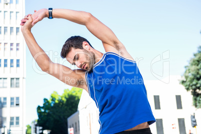 Handsome athlete warming up