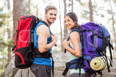 Young happy joggers looking at camera