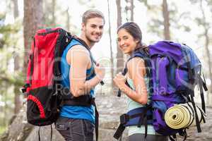 Young happy joggers looking at camera