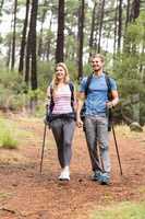 Young happy hiker couple hiking