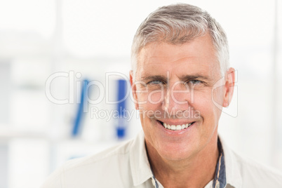 Smiling businessman looking at the camera