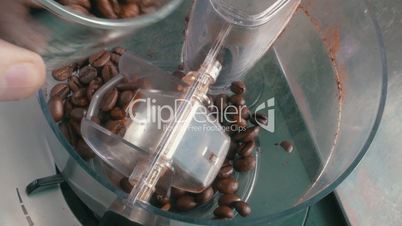 Coffee Beans Added to the Grinder, closeup