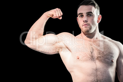 Strong bodybuilder flexing his bicep
