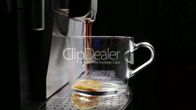 Coffee Machine Making Espresso into a Transparent Cap, closeup