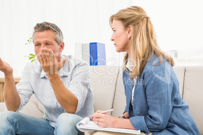 Therapist listening to male patients worries