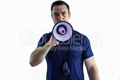 Male trainer yelling through the megaphone Male trainer yelling through the megaphone