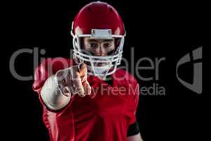 Portrait of american football player pointing to camera