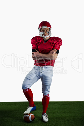 Portrait of american football player with arms crossed