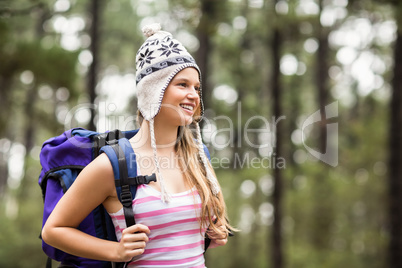 Young happy hiker looking in the distance