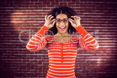 Smiling attractive woman posing with hipster glasses