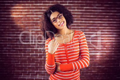 Smiling attractive woman playing with hair