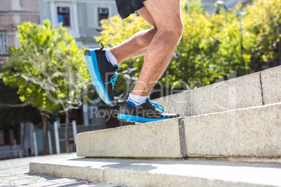 Athlete jogging up the stairs