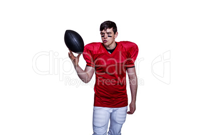 American football player playing with the ball