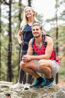 Young happy hiker couple looking away