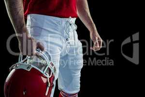 American football player holding his helmet