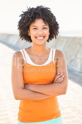 Young sporty woman smiling to camera