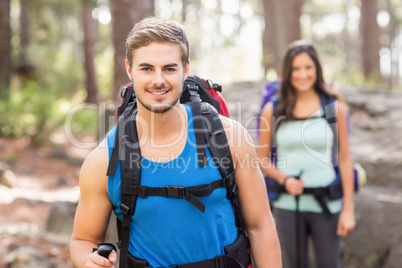 Young happy joggers looking at camera