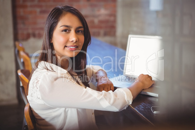 Beautiful businesswoman reading a book