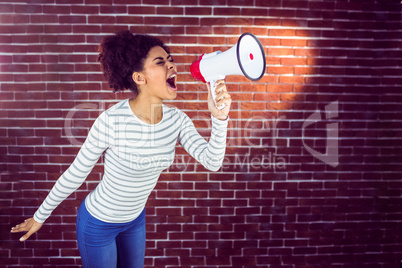 Pretty woman shouting with megaphone