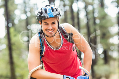 Handsome young biker looking at camera