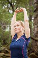 Athletic woman doing arms stretching