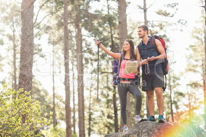 Young happy joggers looking at something in the distance