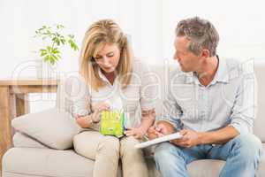 Crying female patient talking to therapist