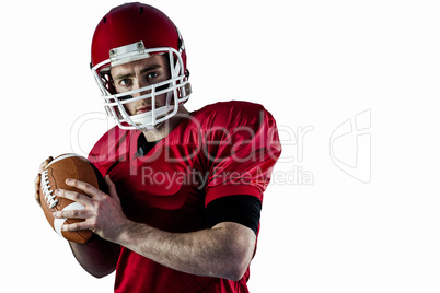 Portrait of american football player being about to throw footba