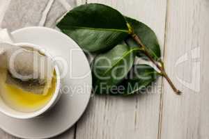 Cup of herbal tea on table