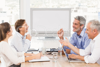 Laughing business people having a meeting