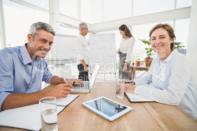 Smiling business people having a meeting