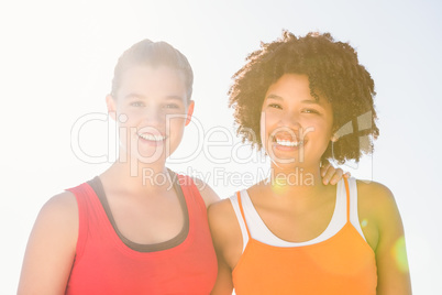 Two young women smiling to camera