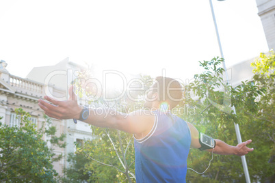 Carefree athlete with arms outstretched