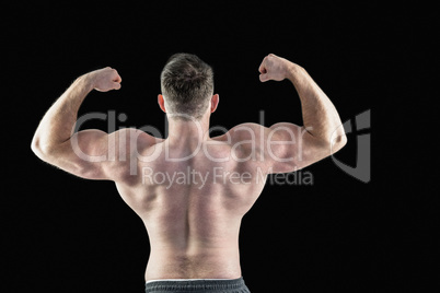 Strong bodybuilder with arms up