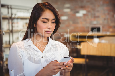 Casual businesswoman using her phones