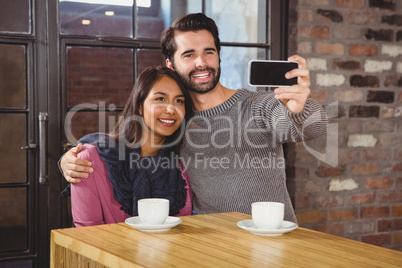 Young happy couple making a selfie